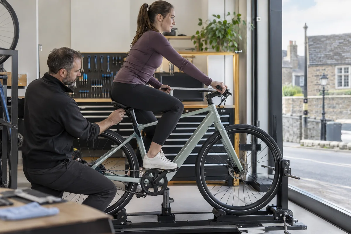 Cyclist or mechanic demonstrating practical considerations for Tenways CGO600 geometry and sizing