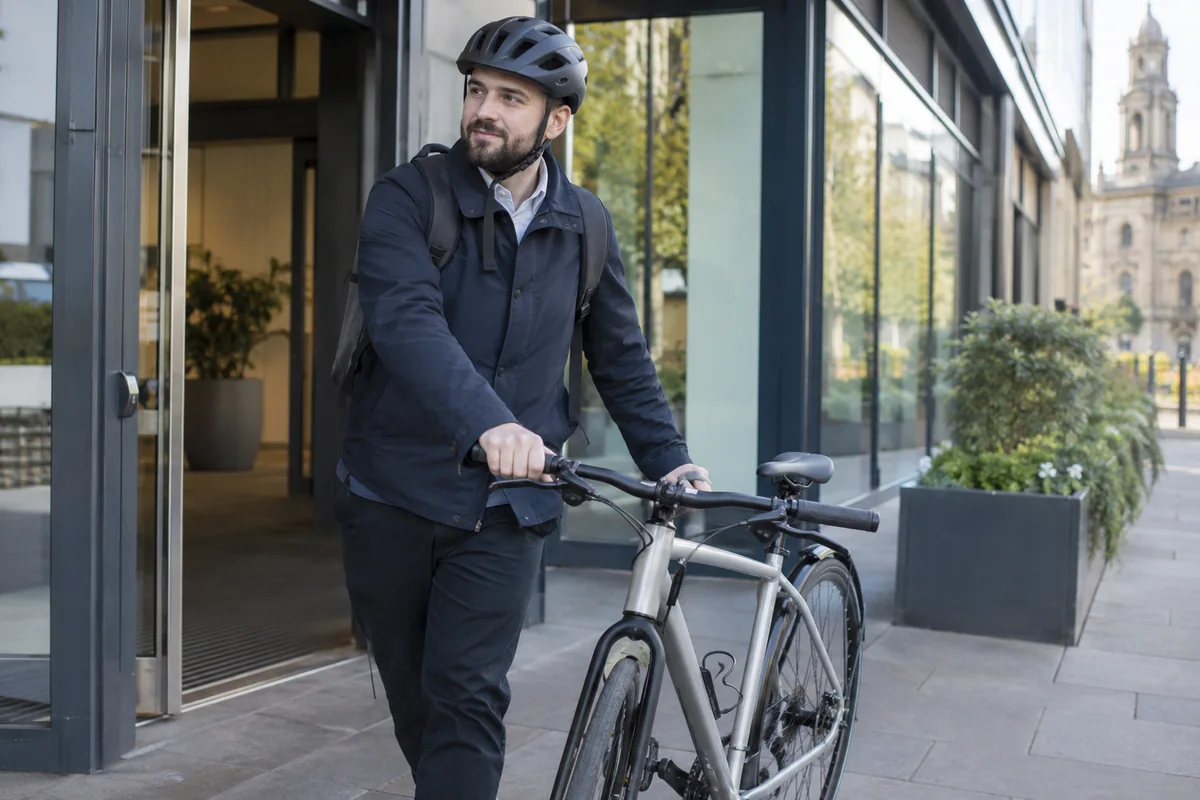 Cyclist or mechanic demonstrating practical considerations for Cycle to Work when leaving your job