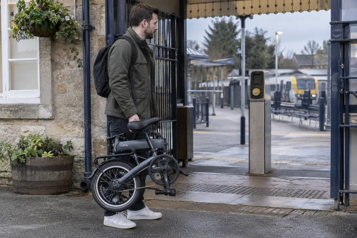 A folding electric bicycle at a station