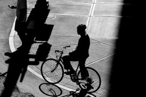 Silhouetted man on bike